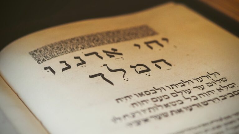 A close-up of children and adults studying Hebrew letters and words together with books and flashcards.