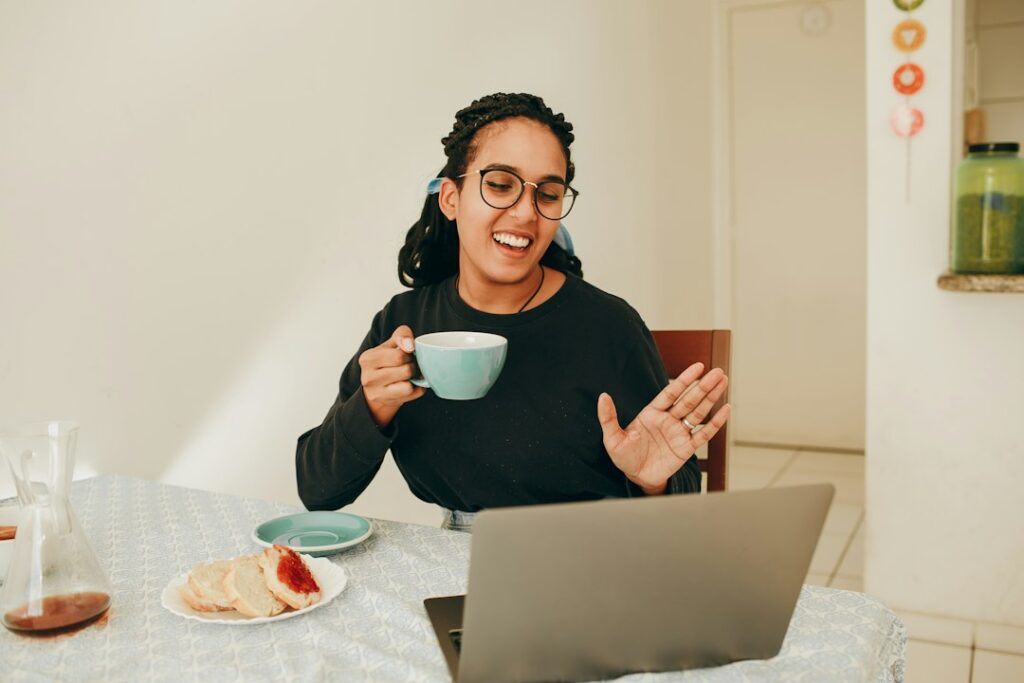 Adult student practices Hebrew reading with a tutor during a video lesson at a home desk.