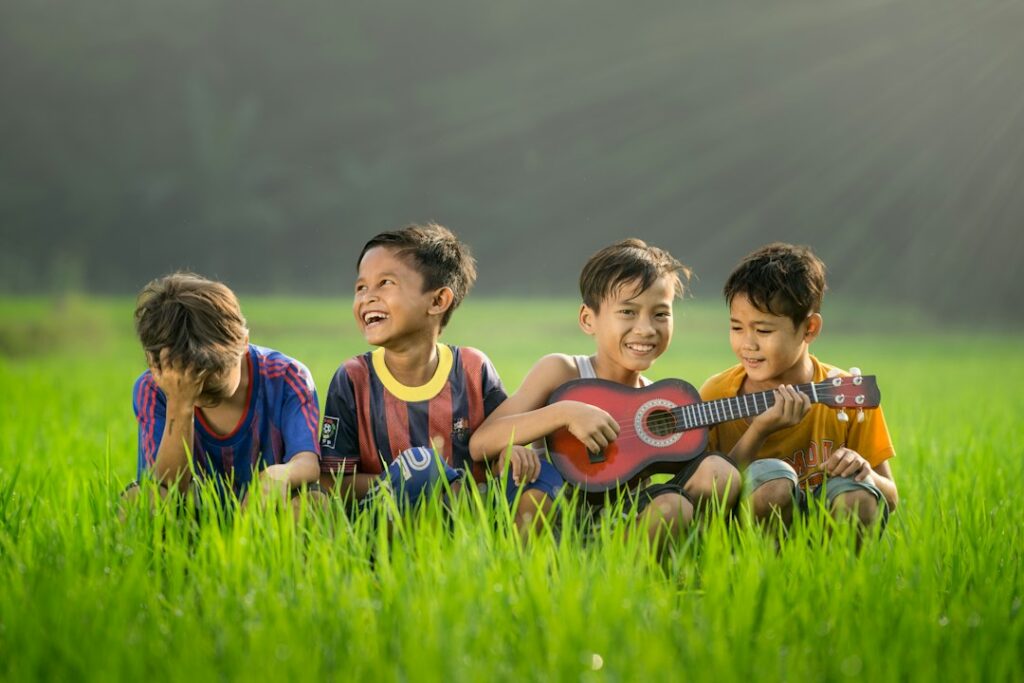 Children and an adult read Hebrew song sheets while singing together in a bright home learning space.