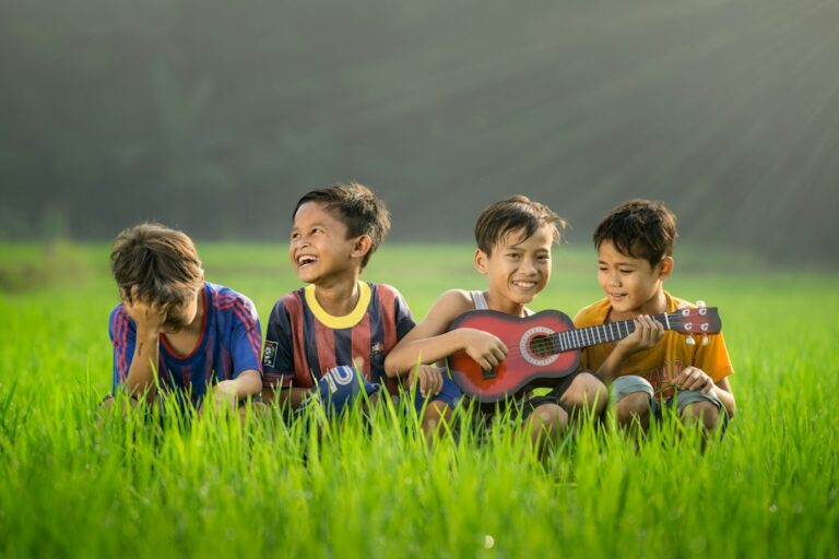 Children and an adult read Hebrew song sheets while singing together in a bright home learning space.