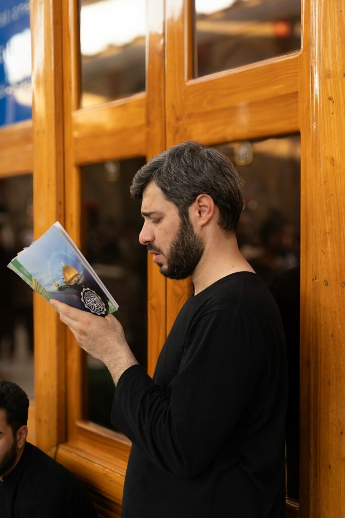 A person points to a Hebrew menu while ordering food and speaking with a server.